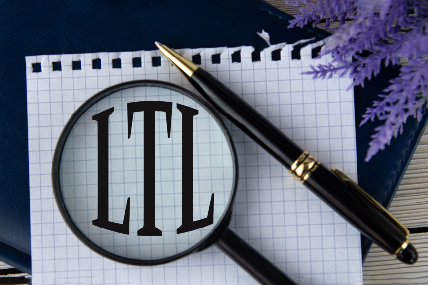 Image of paper, pen, and magnifying glass