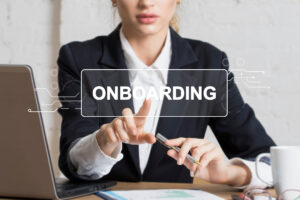 Image of a woman wearing a suit with the text "Onboarding" overlayed